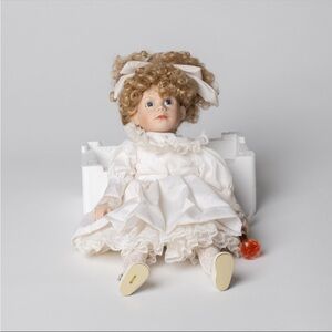 Art Deco Kelly Porcelain Doll with White Dress and Curly Hair